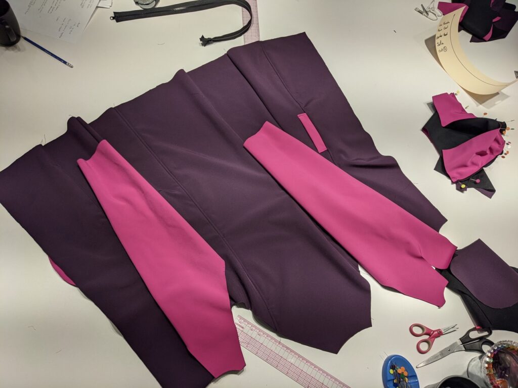 Half sewn rain coat. made from pink and purple fleeceback soft shell