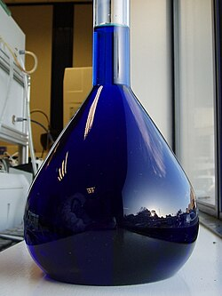 A volumetric flask of a methylene blue solution 